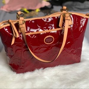 Coach crimson and tan patent leather tote.